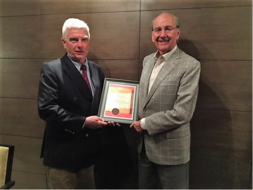 Prof. Paul Robert Magocsi (left) presents the Lviv Book Forum Award to UJE Board chairman James C. Temerty (right) at a special ceremony in Kyiv. 