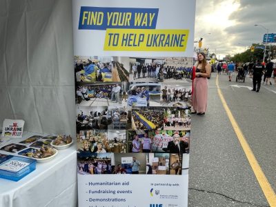 Visitors at the Ukrainian Jewish Encounter (UJE) booth.