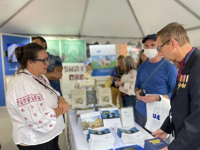 Visitors at the Ukrainian Jewish Encounter (UJE) booth.