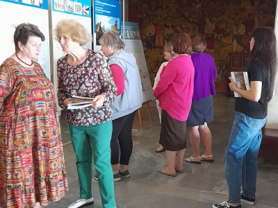 Attendees of the exhibition's opening at the Cherkasy Regional Museum of Local History with their gifts — copies of the catalog "A Journey Through the Ukrainian-Jewish Encounter: From Antiquity to 1914." Cherkasy, 11 June 2025.