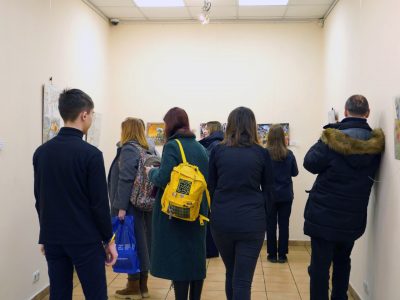 The first visitors admire the works included in the exhibition of the All-Ukrainian Children's Drawing Competition "Ukrainian-Jewish Encounter: A Look into the Future, 2023." Sholem Aleichem Museum. 3 February 2024, Kyiv.