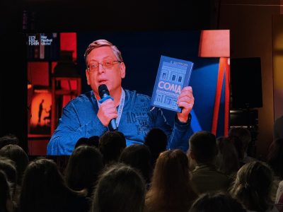 Igor Shchupak with the 2024 Encounter Prize-winning book "Solid. The Life-Saving Footwear Factory."