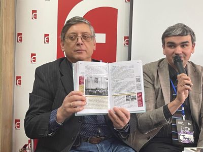 UJE Board Member Igor Shchupak displays his new textbook that has won praise regarding its attitudes toward Israel.