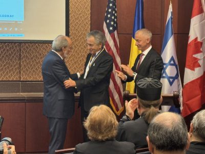 James C. Temerty, C.M., Founder and Board Chairman of the Ukrainian Jewish Encounter (left), and Boris Lozhkin, President of the Jewish Confederation of Ukraine (right), present the Andrey Sheptytsky Medal to Bernard-Henri Lévy (center). (Photo: Mo Broushaky)