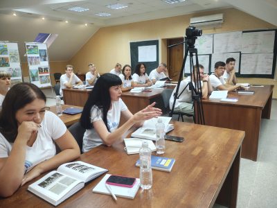 Participants of the Verba Magistri International Methodology Lab Summer School listening to the speakers at the launch of a new edition of "Babyn Yar: History and Memory". Uzhhorod, 1 August 2024.