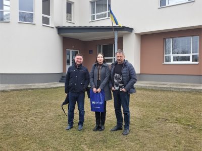 Left to right: Vladyslav Hrynevych, Jr., UJE Regional Manager, Ukraine; Svitlana Hrynevych, Administrator of UJE's Ukrainian Office; Vladyslav Chabaniuk, Director of the State Historical and Cultural Museum-Reserve "Trypillian Culture", Ukrainian film director, historian, and archaeologist. Near the museum's administrative building in the village of Lehedzyne, Talne raion, Cherkasy region, 17 March 2023.