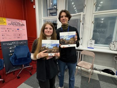 Young Ukrainians with UJE publication "A Journey Through the Ukrainian-Jewish Encounter: From Antiquity to 1914."